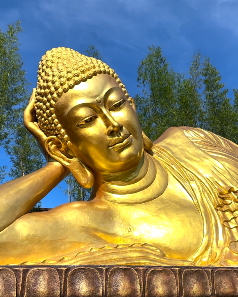 The majestic Sleeping Buddha statue, a serene cultural highlight featured in our exclusive Bintan Private Tours.
