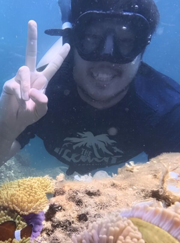 Traveler enjoying a snorkeling activity in tropical waters