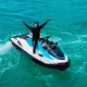 Guests enjoying a thrilling jet ski ride on the beach as part of our exciting Bintan Private Tours.
